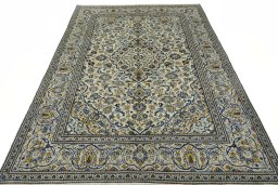 Surface texture of 2000s Kashan rug with natural Wool and intricate pattern