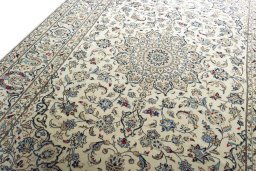 Backside of handmade 2000s Kashan rug showing knot structure and weave density