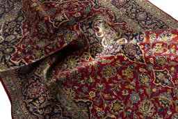 Surface texture of 2000s Kashan rug with natural Cork and intricate pattern