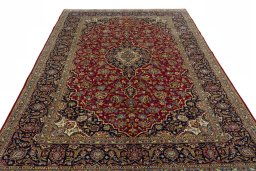 Surface texture of 2000s Kashan rug with natural Cork and intricate pattern