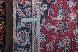 Close-up detail of 2000s Kashan rug from Iran / Persia showing Wool weave