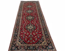 Surface texture of 2000s Kashan rug with natural Wool and intricate pattern