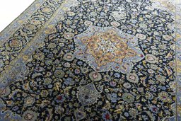 Backside of handmade New Kashan rug showing knot structure and weave density