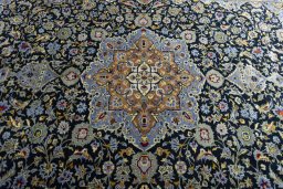 Central medallion detail of New Kashan rug from Iran / Persia