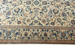 Corner detail of 1970s Kashan rug showing border pattern and Wool pile