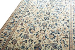 Backside of handmade 1970s Kashan rug showing knot structure and weave density