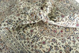 Surface texture of 2000s Kashan rug with natural Wool and intricate pattern