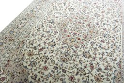 Backside of handmade 2000s Kashan rug showing knot structure and weave density