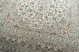 Close-up detail of 2000s Kashan rug from Iran / Persia showing Wool weave