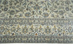 Corner detail of New Kashan rug showing border pattern and Cork pile
