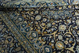 Close-up detail of 2000s Kashan rug from Iran / Persia showing Wool weave