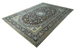 Corner detail of 2000s Kashan rug showing border pattern and Wool pile