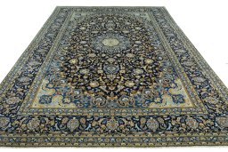 Surface texture of 2000s Kashan rug with natural Wool and intricate pattern