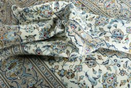 Surface texture of 2000s Kashan rug with natural Wool and intricate pattern