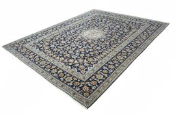 Corner detail of 2000s Kashan rug showing border pattern and Wool pile