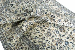 Surface texture of 2000s Kashan rug with natural Wool and intricate pattern