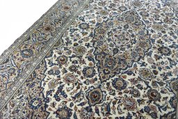 Backside of handmade 2000s Kashan rug showing knot structure and weave density