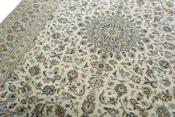 Backside of handmade 2000s Kashan rug showing knot structure and weave density