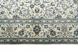 Full view of 2000s Kashan rug from Iran / Persia, 297 × 193 cm in Beige tones
