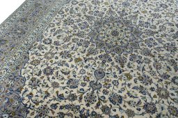 Backside of handmade 2000s Kashan rug showing knot structure and weave density
