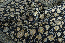 Close-up detail of 2000s Kashan rug from Iran / Persia showing Wool weave