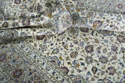 Surface texture of 2000s Kashan rug with natural Wool and intricate pattern
