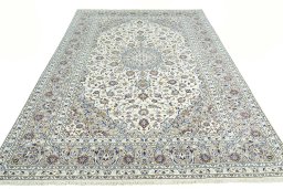 Surface texture of 2000s Kashan rug with natural Wool and intricate pattern