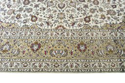 Corner detail of 2000s Kashan rug showing border pattern and Wool pile