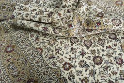 Surface texture of 2000s Kashan rug with natural Wool and intricate pattern