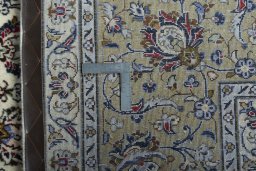 Backside of handmade 2000s Kashan rug showing knot structure and weave density