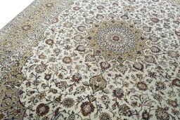 Backside of handmade 2000s Kashan rug showing knot structure and weave density