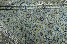 Close-up detail of 2000s Kashan rug from Iran / Persia showing Wool weave