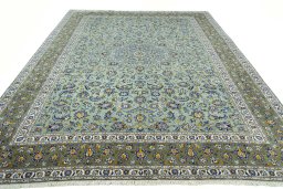 Surface texture of 2000s Kashan rug with natural Wool and intricate pattern