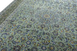 Backside of handmade 2000s Kashan rug showing knot structure and weave density