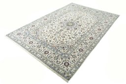 Corner detail of 2000s Kashan rug showing border pattern and Wool pile