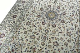 Backside of handmade 2000s Kashan rug showing knot structure and weave density