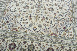 Close-up detail of 2000s Kashan rug from Iran / Persia showing Wool weave