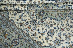 Close-up detail of 2000s Kashan rug from Iran / Persia showing Wool weave