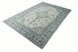 Corner detail of 2000s Kashan rug showing border pattern and Wool pile