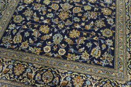 Close-up detail of 2000s Kashan rug from Iran / Persia showing Wool weave