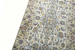 Backside of handmade New Kashan rug showing knot structure and weave density