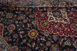 Close-up detail of 2000s Kashan rug from Iran / Persia showing Wool weave