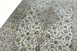 Backside of handmade 2000s Kashan rug showing knot structure and weave density