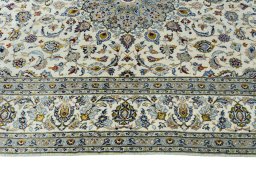 Corner detail of New Kashan rug showing border pattern and Cork pile