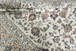Close-up detail of 2000s Kashan rug from Iran / Persia showing Wool weave