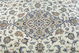 Backside of handmade 2000s Kashan rug showing knot structure and weave density