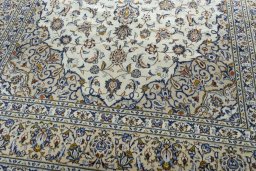 Central medallion detail of 2000s Kashan rug from Iran / Persia