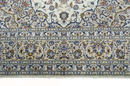 Close-up detail of 2000s Kashan rug from Iran / Persia showing Wool weave
