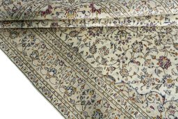 Close-up detail of 2000s Kashan rug from Iran / Persia showing Wool weave