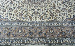 Corner detail of New Kashan rug showing border pattern and Wool pile